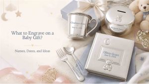 a variety of baby gifts on a table with different engraved names and dates on them