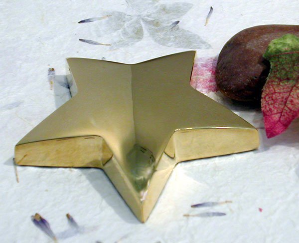 Gold star paperweight engraved as an employee achievement award