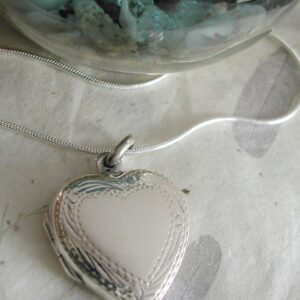 engravable Sterling silver heart locket with decorative border